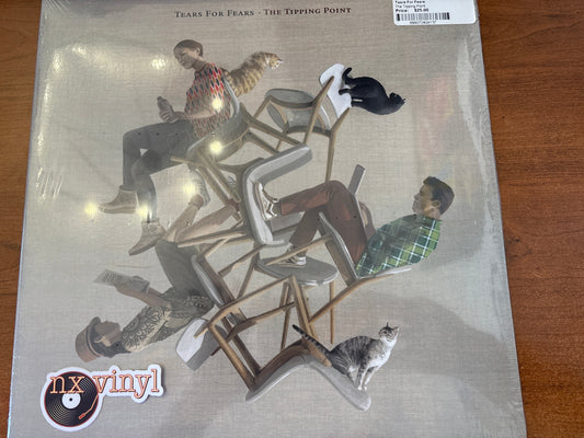 Vinyl record cover with people and cats on chairs, featuring 'nx vinyl' logo.