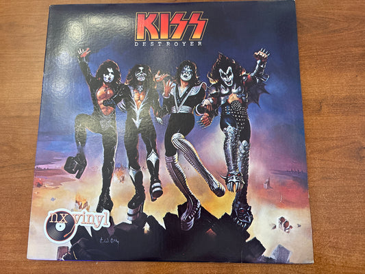 Vinyl record cover for 'Destroyer' by Kiss on a wooden surface