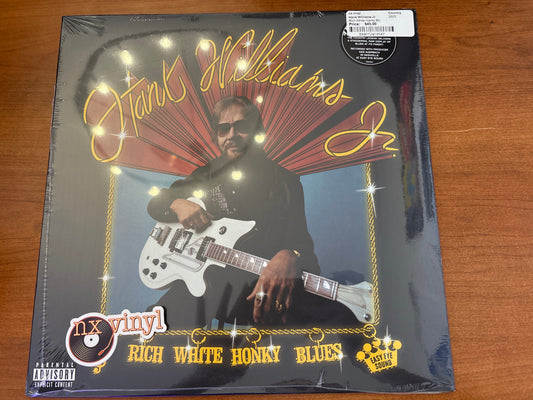 Vinyl record cover with a person playing guitar on a wooden surface